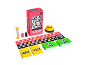 A board game including cards, an hourglass, a buzzer, and a game board.
