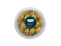 Green olives with coriander and dill in a round, transparent container.