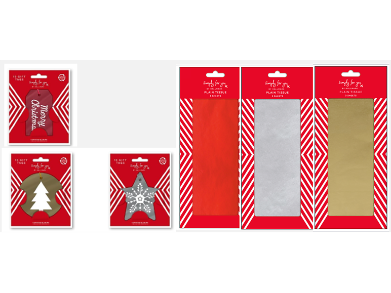 Christmas gift tags and colorful tissue paper for gift wrapping.