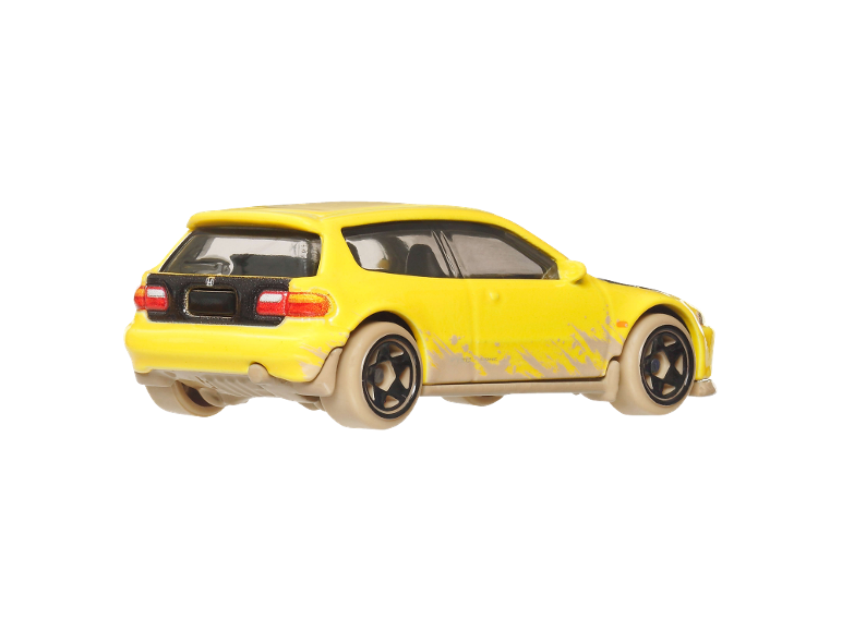 Yellow toy car with dirt, rear view.