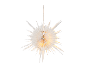 Illuminated paper star Christmas decoration hanging against a black background.