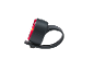 Red bicycle tail light with a black silicone strap.