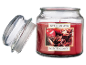 Apple cinnamon scented candle with a glass lid, featuring text 'APPLE CINNAMON SCENTED CANDLE'.
