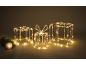 Three illuminated gift boxes with Christmas decorations