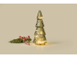 Illuminated decorative Christmas tree with pine branches and red berries.