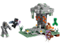 Play set with a grey tree, green creature, skeleton, and other figures.