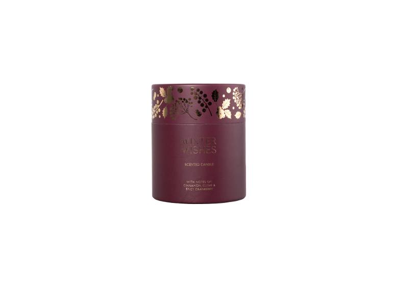 Winter Wishes scented candle with notes of cinnamon, clove, and spicy cranberry.