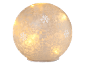 Decorative glowing globe with snowflake pattern and warm light