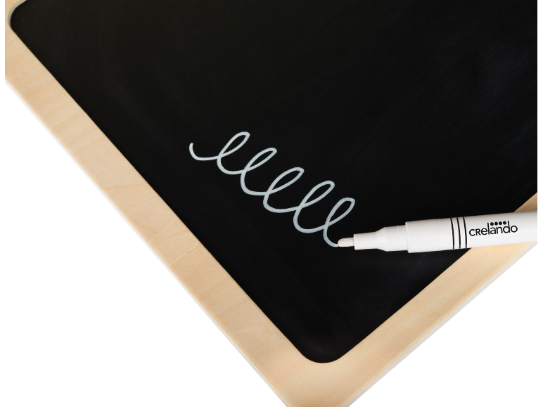 Blackboard with a wooden frame and a white marker drawing a spiral.