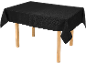 Black tablecloth with a subtle floral pattern on a wooden table.