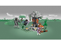 Building block set with character figures and a tree, in a blocky landscape.