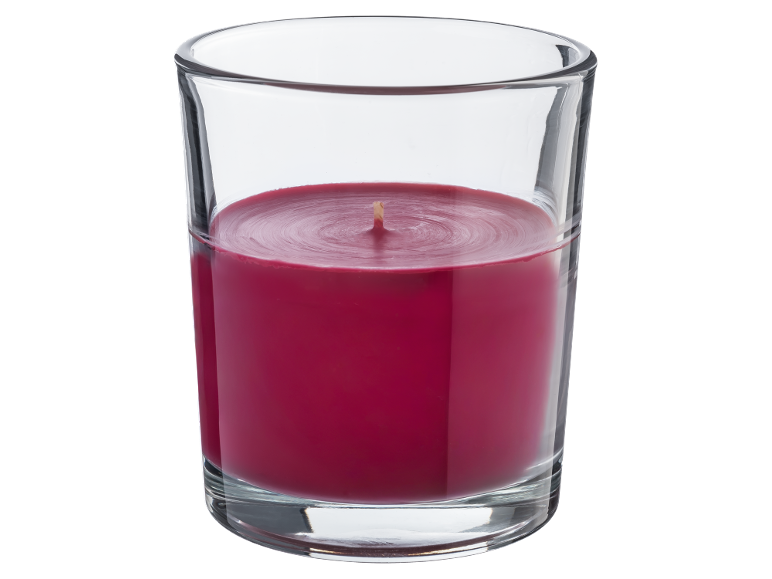 Red candle in glass container