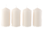 Four unlit white pillar candles on a black background.