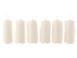 Six unlit white pillar candles with wicks, arranged in a row against a black background.