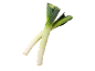 Two fresh leeks with green leaves and white stalks, crossed on a black background.