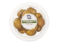 Halkidiki olives from Greece with thyme and pit in a transparent container.