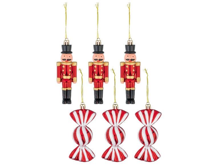 Christmas ornaments: three red and gold toy soldiers and three red and white candy ornaments.
