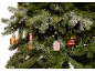 Christmas tree with beauty-themed ornaments: perfume, lipstick, nail polish, and lips.