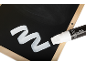 Black chalkboard with wooden frame and white marker drawing a wavy line.