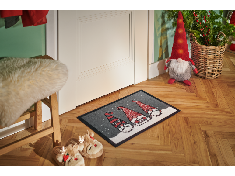 Christmas gnome doormat with three gnomes, slippers, and a decorative gnome