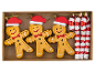 Christmas ornaments: three gingerbread men with Santa hats and three candy canes in a box.