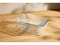 Set of three Silvercrest rectangular glass containers, nested, on a wooden table.