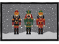 Christmas welcome mat with three nutcrackers, falling snow, and snowy landscape.
