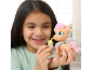 Girl playing with a small pony toy and a bottle.
