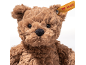 Fluffy brown teddy bear with a yellow tag in its ear.
