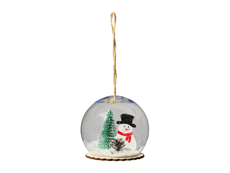 Christmas snow globe with a Christmas tree and a snowman.