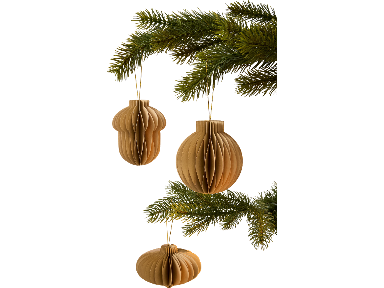 Brown paper Christmas decorations hanging from a green fir tree.