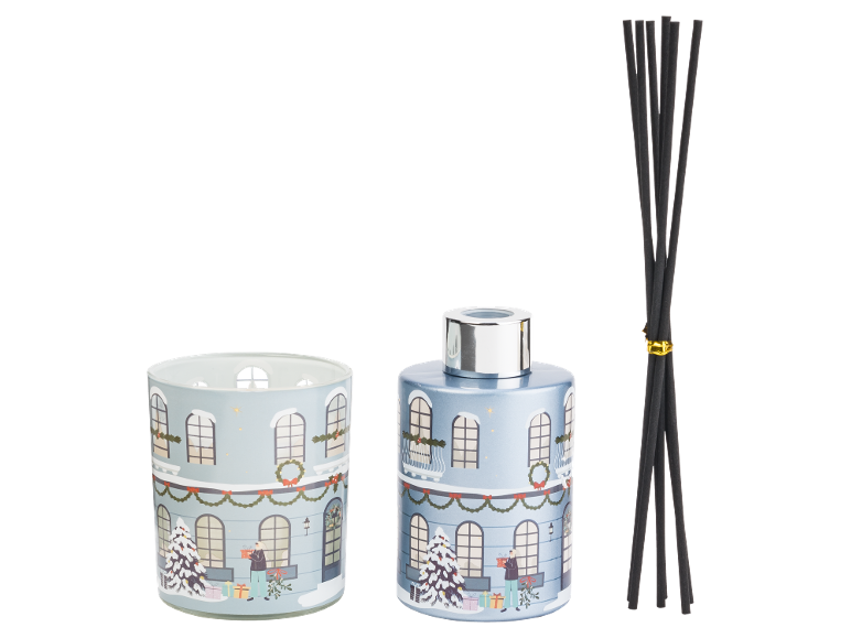 Christmas-themed fragrance diffuser and tealight holder with a snowy house design.