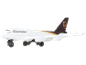 White toy airplane with a brown and gold stripe and the text 'Worldwide Services'.