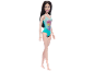 Doll in a turquoise swimsuit with a pink flamingo print.
