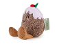 Plush toy in the shape of a Christmas pudding with a cute face