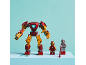Red and gold toy robot with two small figures on a blue surface.
