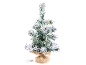 Small artificial Christmas tree with snow and LED lights in a jute pot.