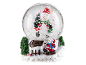 Christmas snow globe with a snowman ice skating and another snowman on a sled
