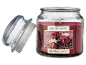 Winter Berries scented candle with glass lid next to it