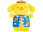 Yellow plush toy with a brown beret and a blue vest over a checkered shirt.