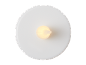 Top-down view of a white LED tea light with a warm yellow glow.
