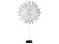 Table lamp with a white, folded paper flower-shaped lampshade on a black base.