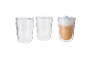 Set of three double-walled glass cups, one filled with coffee and milk foam