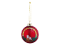 Red Christmas bauble with candles, leaves, and pinecones, hanging from a gold string.