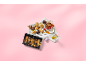 Baklava assortment in a box and on a serving platter with raspberries and dried figs