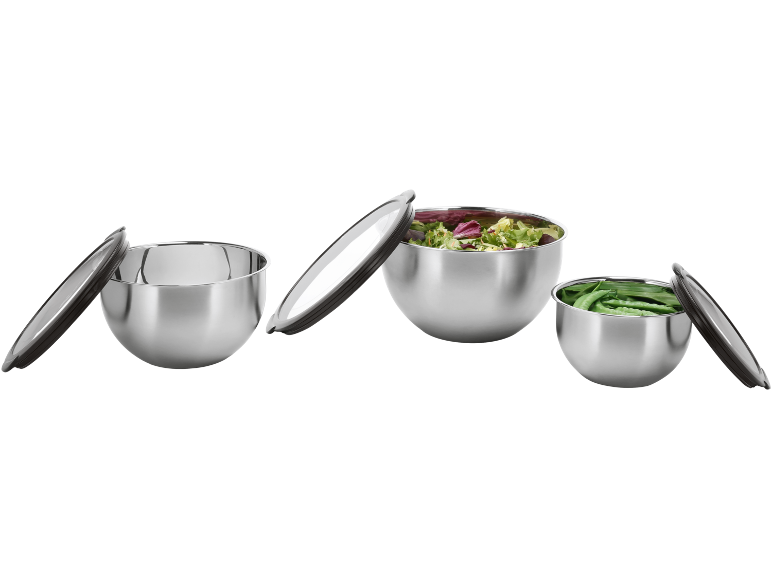 Set of three steel bowls with lids, two filled with salad and green peas.