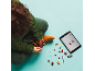 Child building a toy robot with digital instructions on a tablet.