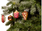 Christmas tree with fast food ornaments: hot dog, burger, french fries, and pizza slice.