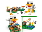 Building block set with a giant chicken, a character, and a chicken coop.