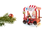 Christmas tree with red bauble and wooden cotton candy cart with figurines.